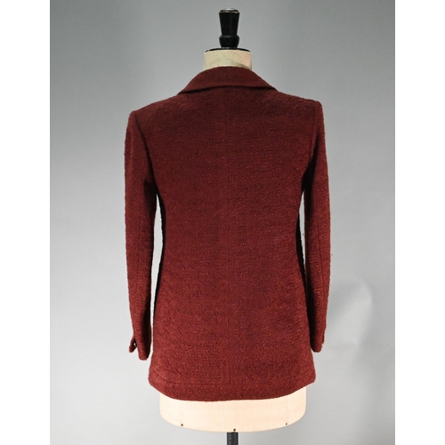 1189 - A Chanel Boutique fitted burgundy jacket in wool and mohair, long line, single breasted with two low... 