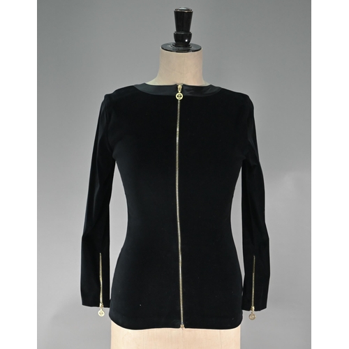 1191 - Chanel - A black velvet fitted evening top with Chanel motif zip fastening to length of back and cuf... 