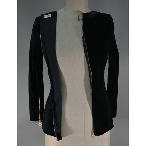 1191 - Chanel - A black velvet fitted evening top with Chanel motif zip fastening to length of back and cuf... 