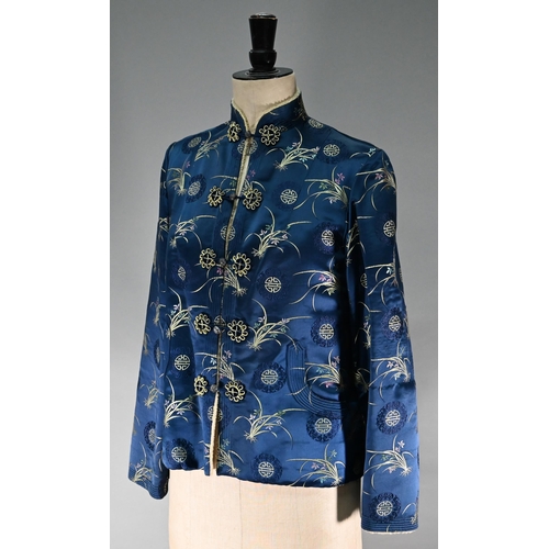 1192 - A Chinese navy blue silk mandarin-style jacket with shaped collar and buttons to front, sheepskin-ty... 