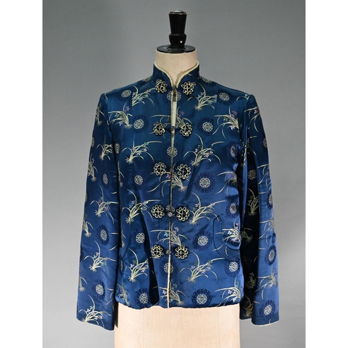 1192 - A Chinese navy blue silk mandarin-style jacket with shaped collar and buttons to front, sheepskin-ty... 