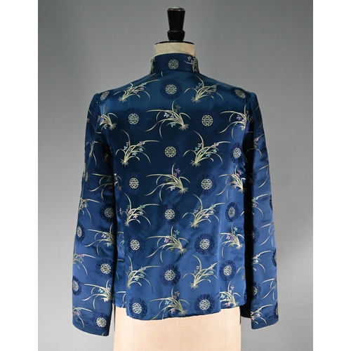 1192 - A Chinese navy blue silk mandarin-style jacket with shaped collar and buttons to front, sheepskin-ty... 