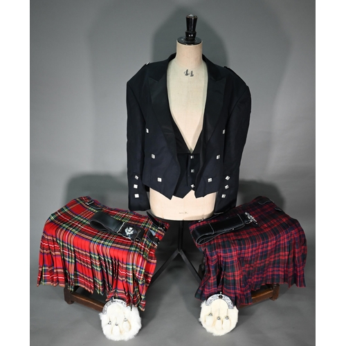 1199 - A pair of grey tartan trousers by the Kilt Society, 46R; two tartan kilts, size 46/48 amd 48 and c/w... 