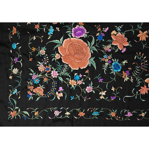 1204 - A Chinese silk fringed piano shawl, the black ground richly decorated with flowers and foliage, 130 ... 