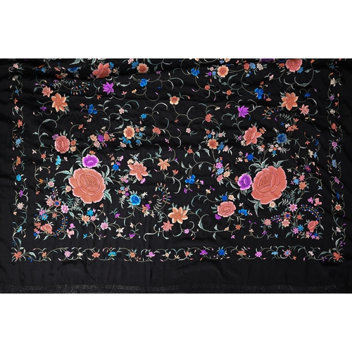 1204 - A Chinese silk fringed piano shawl, the black ground richly decorated with flowers and foliage, 130 ... 