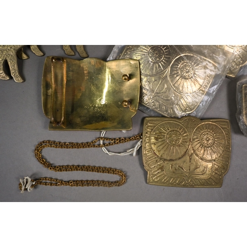 1205 - A collection of twenty Indian cast brass buckles, some in the form of standing rams, some with chase... 