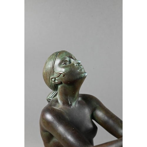 1212 - An Art Deco verdigris patinated bronze table lamp, modelled as a kneeling woman with bowl of fruit, ... 