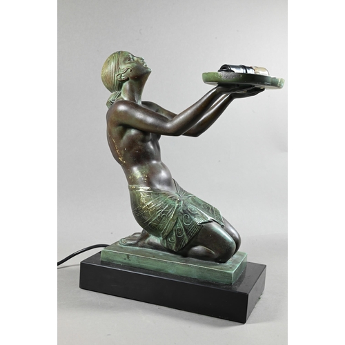 1212 - An Art Deco verdigris patinated bronze table lamp, modelled as a kneeling woman with bowl of fruit, ... 