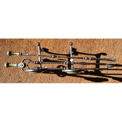 1214 - A Regency steel hearth tongs and poker set with brass handles to/w a pair of Arts & Crafts style... 