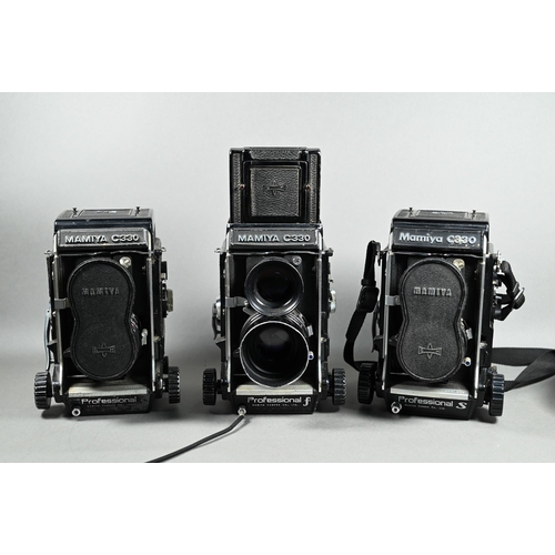 1222 - Three Mamiya C330 twin-lens reflex cameras with accessories