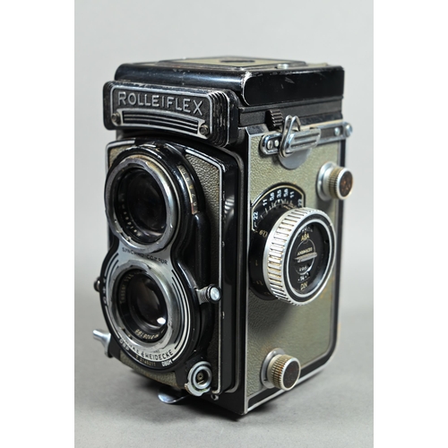 1223 - A Rolleiflex twin-lens reflex camera with Synchro-Compur lens, in leather case with trigger-handle, ... 