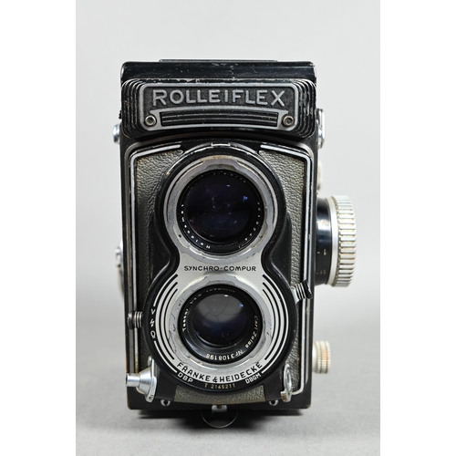 1223 - A Rolleiflex twin-lens reflex camera with Synchro-Compur lens, in leather case with trigger-handle, ... 