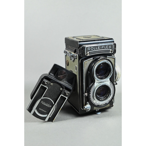 1223 - A Rolleiflex twin-lens reflex camera with Synchro-Compur lens, in leather case with trigger-handle, ... 