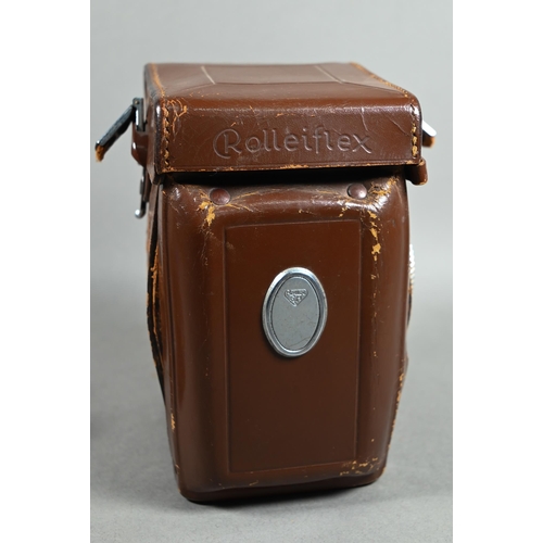 1223 - A Rolleiflex twin-lens reflex camera with Synchro-Compur lens, in leather case with trigger-handle, ... 