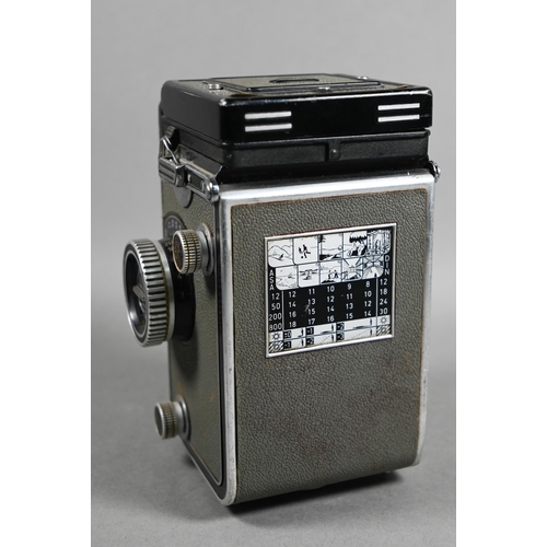 1223 - A Rolleiflex twin-lens reflex camera with Synchro-Compur lens, in leather case with trigger-handle, ... 