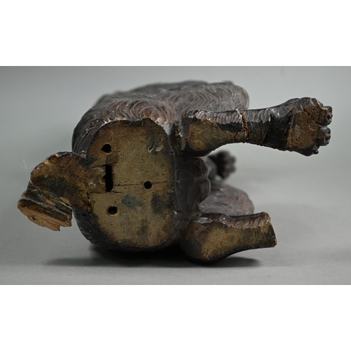 1235 - A Black Forest carved wood begging dog, 60 cm high (one foot missing, the others repaired, lower jaw... 