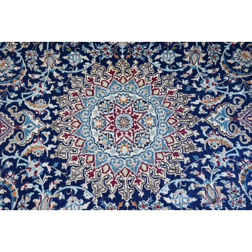 804 - A central Persian part silk Nain carpet, the field centred by a medallion with flowering vines, on b... 