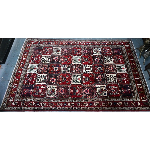 805 - An old Persian Bakhtiar tile design rug, with differing floral motifs,  240 cm x 150 cm