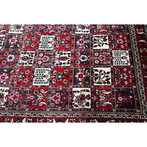 805 - An old Persian Bakhtiar tile design rug, with differing floral motifs,  240 cm x 150 cm