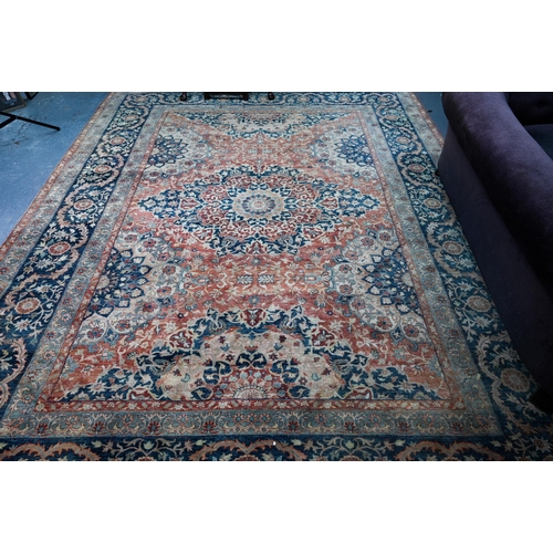 806 - An Indo-Persian Tabriz carpet, the blue/coral ground centred by a floral medallion 356cm x 269cm