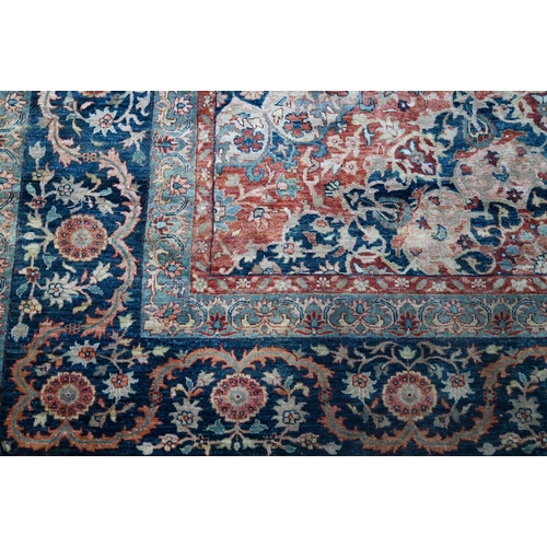 806 - An Indo-Persian Tabriz carpet, the blue/coral ground centred by a floral medallion 356cm x 269cm