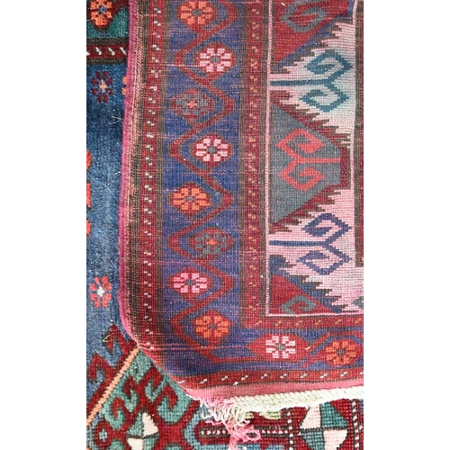 811 - An old Caucasian kelleh carpet, the blue ground with multi-coloured lozenge design, 326 cm x 178 cm