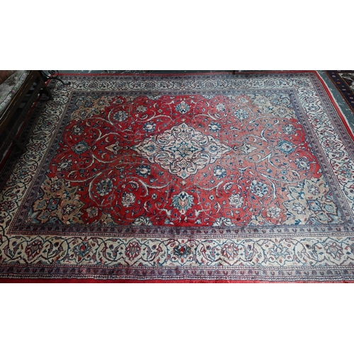 812 - An old Persian mahal carpet, the pale red ground centred by a stylised floral medallion, 377 cm x 27... 