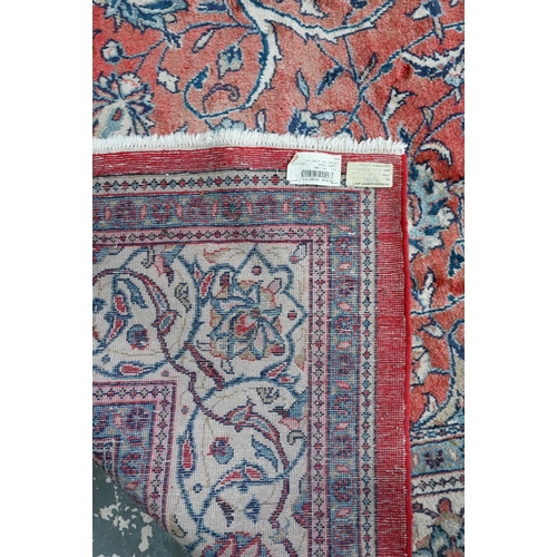 812 - An old Persian mahal carpet, the pale red ground centred by a stylised floral medallion, 377 cm x 27... 