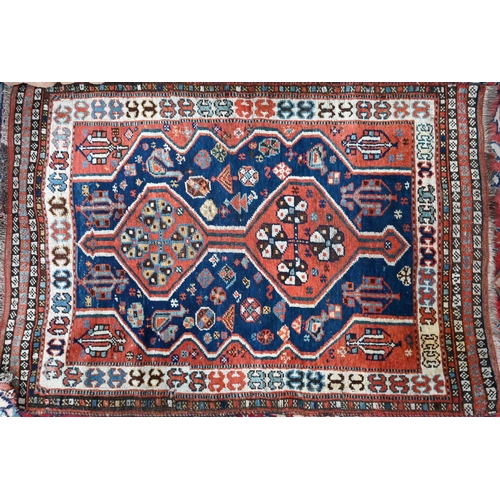 813 - An antique Southern Caucasus rug, the blue ground with twin lozenge pole design, 135 cm x 90 cmProve... 