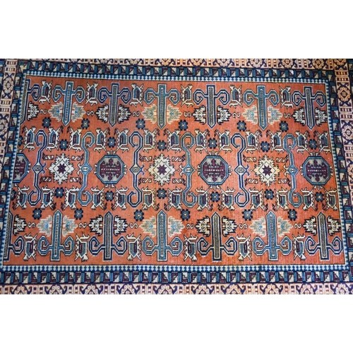 814 - A fine North West Persian Ardebil rug, coral ground, 188 cm x 140 cm