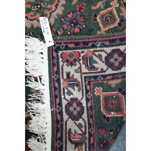 815 - An old Persian green ground runner, 292 cm x 76 cm