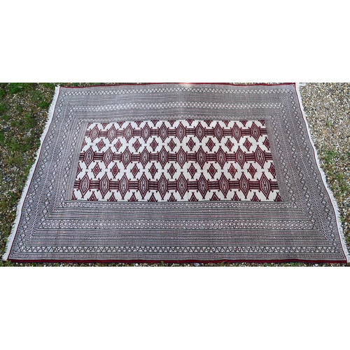 816 - Turkoman Tekke camel ground rug, the design of repeating guls in red, 176 cm x 127 cm