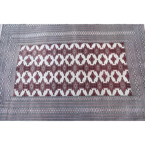 816 - Turkoman Tekke camel ground rug, the design of repeating guls in red, 176 cm x 127 cm