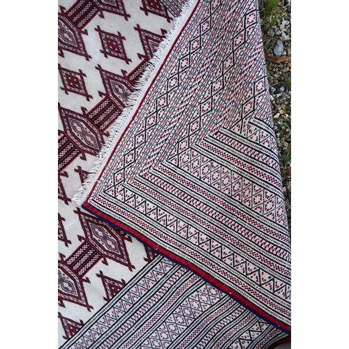 816 - Turkoman Tekke camel ground rug, the design of repeating guls in red, 176 cm x 127 cm