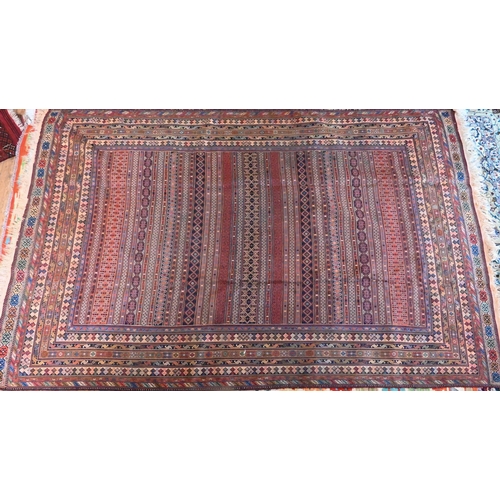 828 - A vintage Moroccan geometric design Sumak weave carpet, multi-coloured bands within conforming borde... 