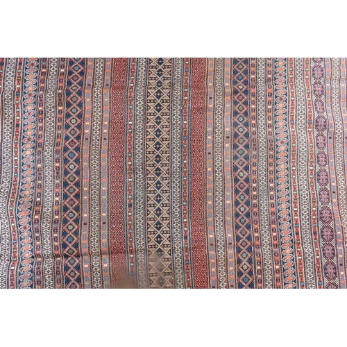 828 - A vintage Moroccan geometric design Sumak weave carpet, multi-coloured bands within conforming borde... 