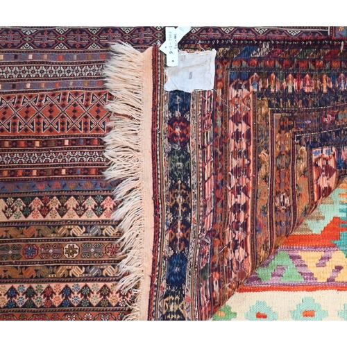 828 - A vintage Moroccan geometric design Sumak weave carpet, multi-coloured bands within conforming borde... 