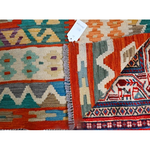 829 - A contemporary Anatolian Kilim, multi-coloured geometric design, 289 cm x 204 cm