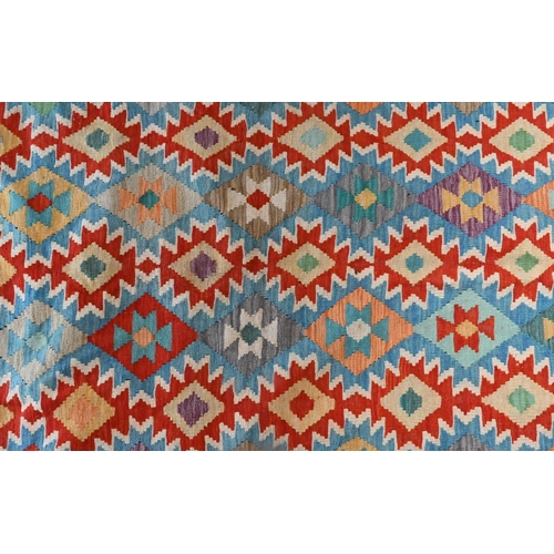 829 - A contemporary Anatolian Kilim, multi-coloured geometric design, 289 cm x 204 cm