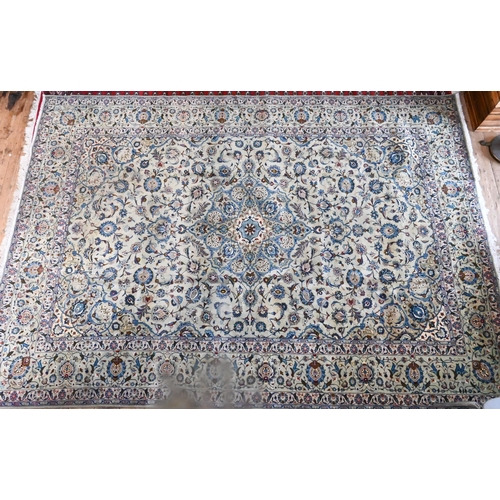 833 - A contemporary central Persian Kashan carpet, the pale jade and camel ground with stylised floral de... 