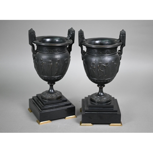 841 - A pair of 19th century Neo-Classical style dark patinated bronze table urns, on conforming bases and... 