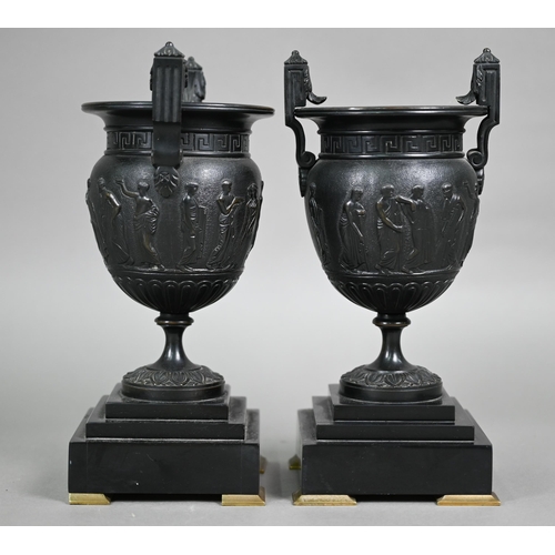 841 - A pair of 19th century Neo-Classical style dark patinated bronze table urns, on conforming bases and... 