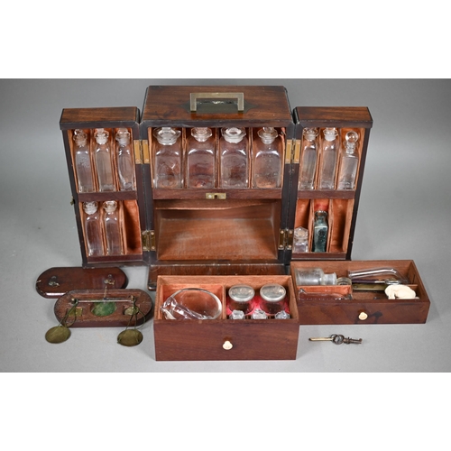 842 - A George III mahogany apothecary box, the top with recessed brass carrying handle over a pair of doo... 