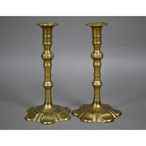 843 - A pair of early 19th century cast brass candlesticks, 21 cm h (2)