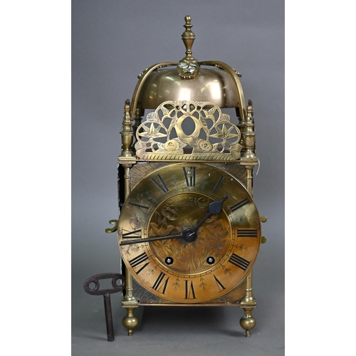 845 - A large brass 17th century style lantern clock, the engraved dial signed Thomas Madge, with two trai... 