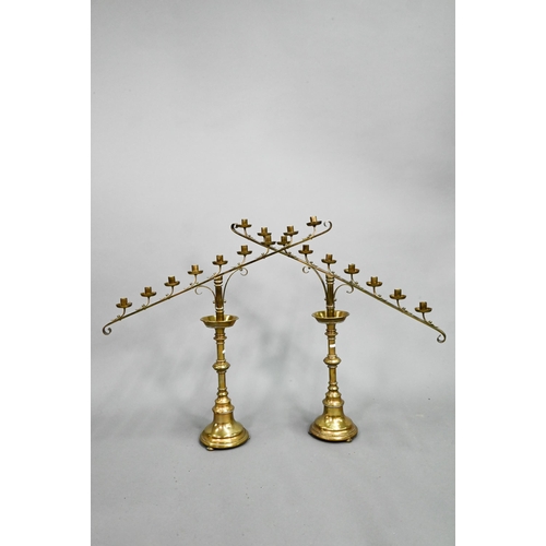 849 - A large pair of antique brass candelabra, the single socket with detachable nine arm sockets, on tur... 