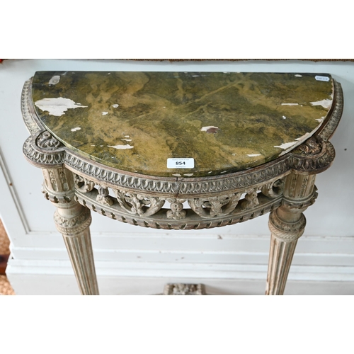 854 - A pair of antique continental carved lime wood demi-lune console tables, the (loose) tops with aged ... 