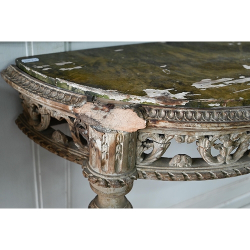 854 - A pair of antique continental carved lime wood demi-lune console tables, the (loose) tops with aged ... 