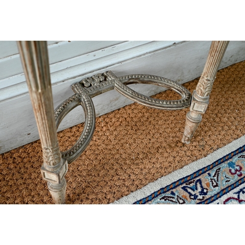 854 - A pair of antique continental carved lime wood demi-lune console tables, the (loose) tops with aged ... 