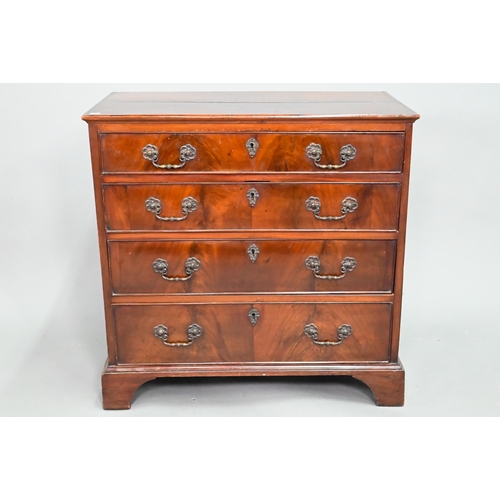 855 - A George III mahogany chest of four long graduated drawers, with later cast brass fittings, raised o... 